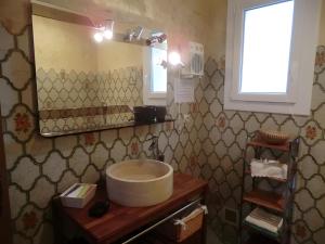 a bathroom with a sink and a mirror at Lou Brès En Provence Près D'Avignon in Vedène +31 photos