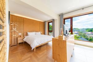 Postel nebo postele na pokoji v ubytování Anji Bamboo Homestay