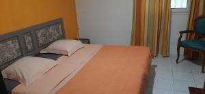 Postel nebo postele na pokoji v ubytování Appartement LETCHIS MANGUE