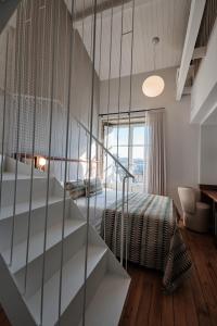 Ein Bett oder Betten in einem Zimmer der Unterkunft Hotel Gaio 7