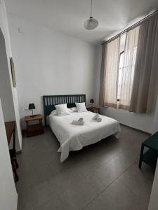 Ένα ή περισσότερα κρεβάτια σε δωμάτιο στο Hotel Entreolivos +105 φωτογραφίες