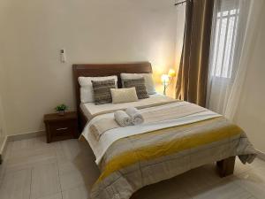 Postel nebo postele na pokoji v ubytování Apartment deux chambre équipé