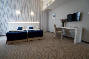 Posteľ alebo postele v izbe v ubytovaní Hotel Aleksandria