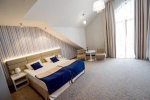 Posteľ alebo postele v izbe v ubytovaní Hotel Aleksandria