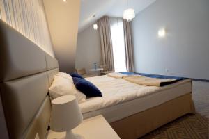 Posteľ alebo postele v izbe v ubytovaní Hotel Aleksandria