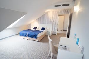 Posteľ alebo postele v izbe v ubytovaní Hotel Aleksandria
