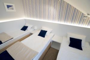 Posteľ alebo postele v izbe v ubytovaní Hotel Aleksandria