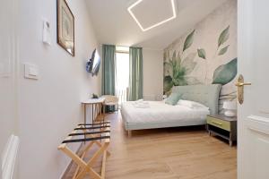 a bedroom with a bed and a desk in a room at 4BNB - Stylish Spacious Apartment near Vatican in Rome