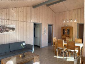 a living room with a couch and a table at Seeschwalbe 69A in Rechlin