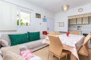 a living room with a couch and a table at Apartment LEMONA in Makarska