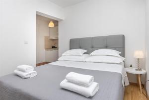 Posteľ alebo postele v izbe v ubytovaní Apartments Marijo