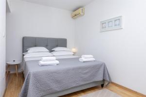 Posteľ alebo postele v izbe v ubytovaní Apartments Marijo