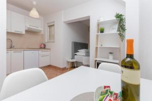 Kuchyňa alebo kuchynka v ubytovaní Apartments Marijo