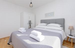 Posteľ alebo postele v izbe v ubytovaní Apartments Marijo