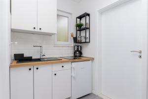 Kuchyňa alebo kuchynka v ubytovaní Apartments Marijo