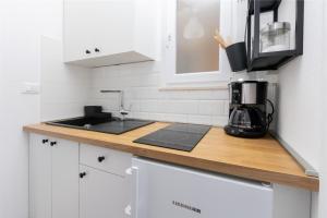 Kuchyňa alebo kuchynka v ubytovaní Apartments Marijo