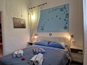 A bed or beds in a room at Casa Albergheria