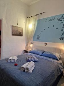 A bed or beds in a room at Casa Albergheria