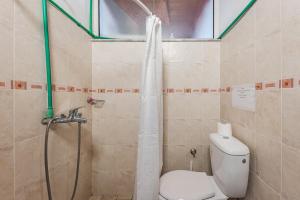 a bathroom with a shower and a toilet in it at 'Easy Steps' Guesthouse - Room 1 - Pro Bono in Shkodër