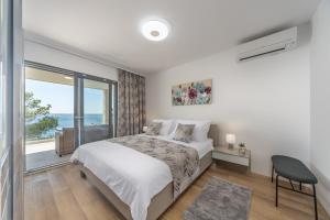 Posteľ alebo postele v izbe v ubytovaní Villa Neptune + 37 fotografií