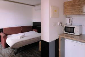 Nhà bếp/bếp nhỏ tại Rich Apartments