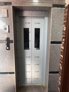a pair of doors in a building at SRI HARI RESIDENCy in Kanipakam