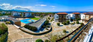 an aerial view of a house with a swimming pool at Boho Beach Apartment in Tatlisu