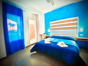 Ένα ή περισσότερα κρεβάτια σε δωμάτιο στο Albergo 2 Mari
