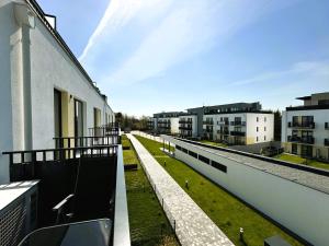 a view of a balcony of a building at Klify Jastrzębie Premium in Jastrzębia Góra