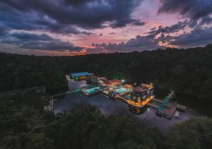 an overhead view of a ship in a river at sunset at Uiara Amazon Resort in Manaus
