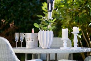 a table with candles and wine glasses on it at Pendle View Apartment in Settle