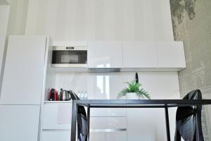 Kuchyň nebo kuchyňský kout v ubytování PORTA NUOVA SUITES