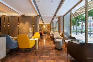 Posezení v ubytování Echarm Plus International Hotel Ouzhuang Metro Station Branch - Free Deliver Service to Canton Fair Complex During Canton Fair Period