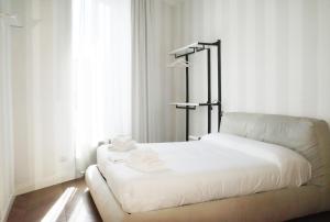 Postel nebo postele na pokoji v ubytování PORTA NUOVA SUITES