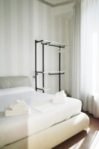 Postel nebo postele na pokoji v ubytování PORTA NUOVA SUITES