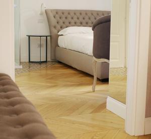 Postel nebo postele na pokoji v ubytování PORTA NUOVA SUITES