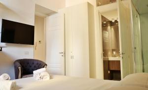 Postel nebo postele na pokoji v ubytování PORTA NUOVA SUITES
