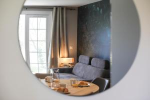 a living room with a table and a couch at Cozy apartment in Port Bourgenay in Talmont