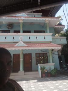 a man standing in front of a house at Sscouples in Varkala