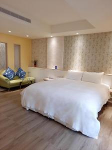 Postel nebo postele na pokoji v ubytování 愛菲爾Motel