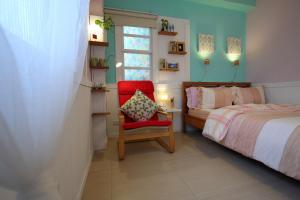 Postel nebo postele na pokoji v ubytování Huxi B&B
