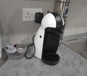a black and white mixer sitting on a counter at Sandstone A8 Marsascala - 15minute drive to Valletta in Marsaskala