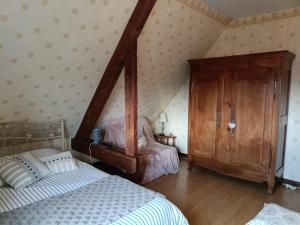 Postel nebo postele na pokoji v ubytování Maison d'hôtes Les Vallées