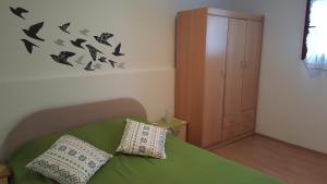 Postel nebo postele na pokoji v ubytování Apartment Ecio