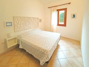 En eller flere senge i et værelse på Sun and Sea LT - Piscina Condominiale - PMS CaseVacanze