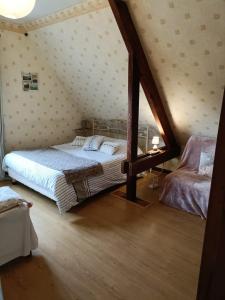 Postel nebo postele na pokoji v ubytování Maison d'hôtes Les Vallées