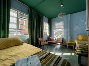 Postel nebo postele na pokoji v ubytování Hostal Bubango