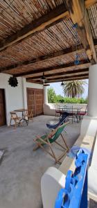 a room with chairs and tables in a building at Nicaredda in Stromboli