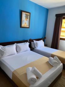 Postel nebo postele na pokoji v ubytování Hotel Chaouen