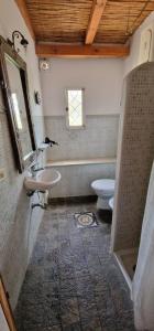 a bathroom with a sink and a toilet at Nicaredda in Stromboli